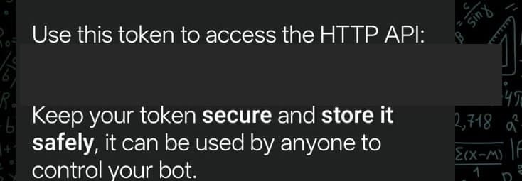 BotFather's reply confirming the token was issued, with the token itself hidden